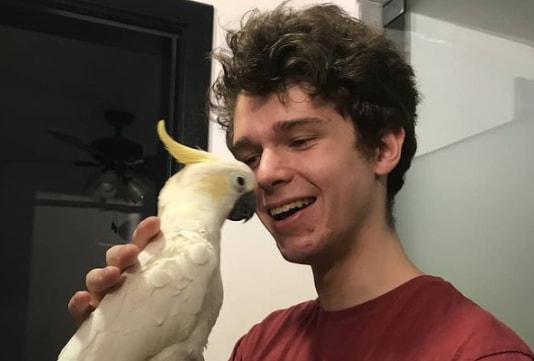 Eret with his pet parrot
