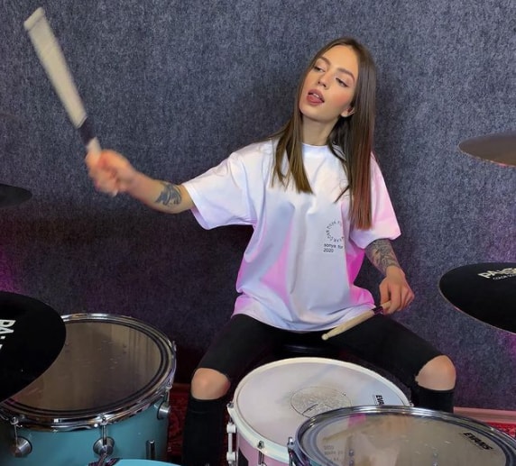 Kristina Rybalchenko playing drum