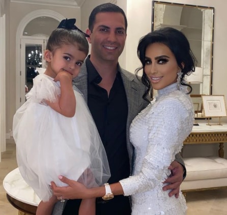 Lilly Ghalichi with her husband and baby