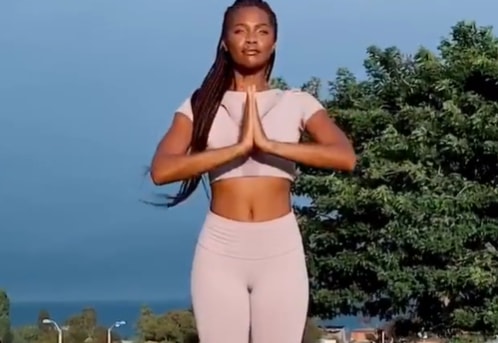 Mamé performing yoga