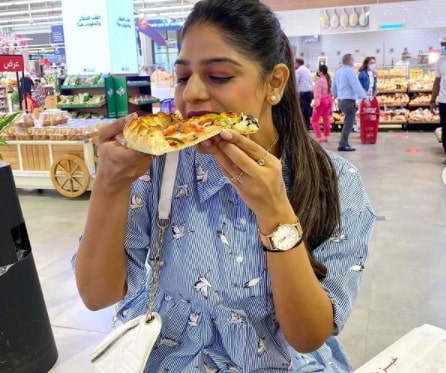Naimi shah enjoying delicious pizza
