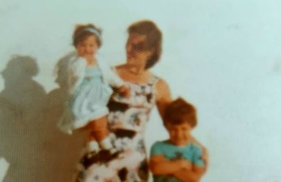 Paula with her mother and brother during childhood