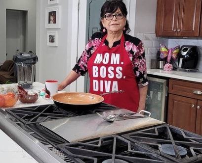 Rosa Rivera cooking in her kitchen.