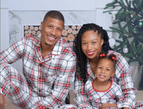Allyson Felix eith her husband and daughter