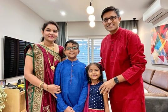 Amit Bhawani with his wife and children