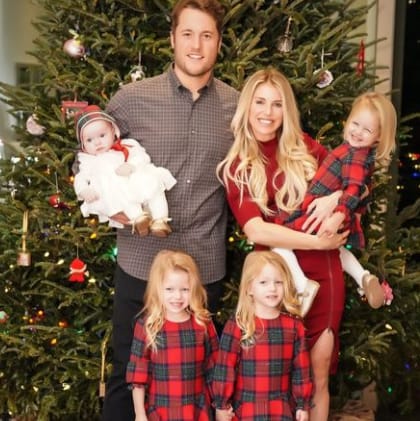 Kelly Stafford with her husband and daughter in Christmas costume