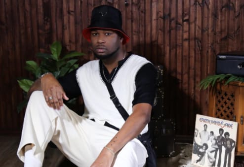 Kelz Wright looks handsome in a black and white outfit