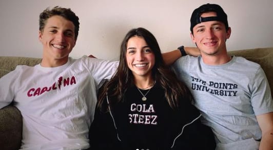 Ellie Dobleske with the owners of  the Cola Steez clothing brand