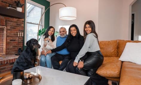 Krystal Lora with her family members and pet dog