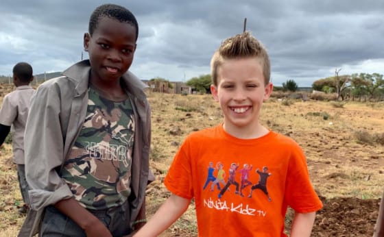 Paxton Myler with a African kid