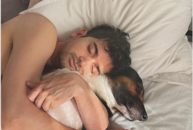 Anant Joshi sleeping with his pet dog