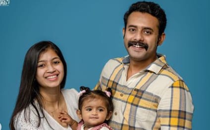 Arjun Ashokan with his wife and daughter