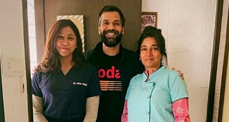 Neil Bhoopalam with two ladies