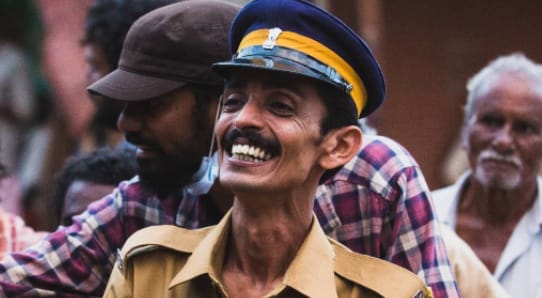 Rajesh Madhavan in a police costume