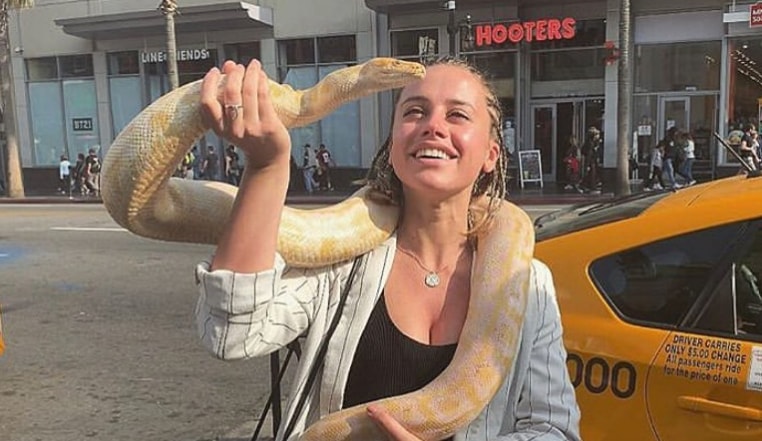 Caterina Biasiol playing with a snake