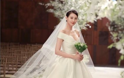 Claudia Kim looks gorgeous in a wedding dress