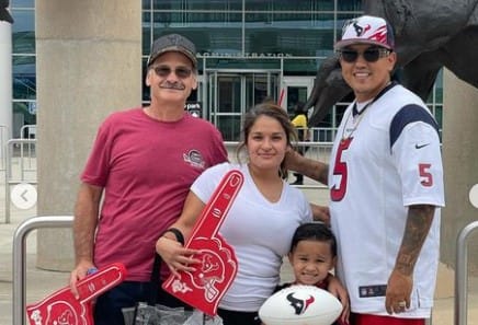 Randy Gonzalez with his wife, son, and father
