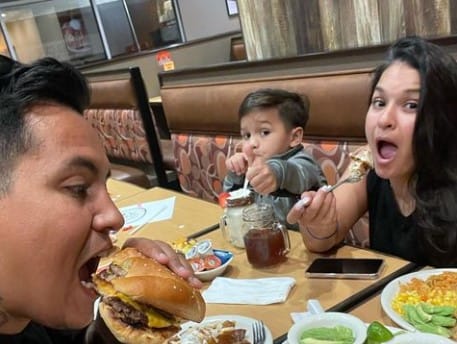 Randy Gonzalez doing dinner with his son and wife