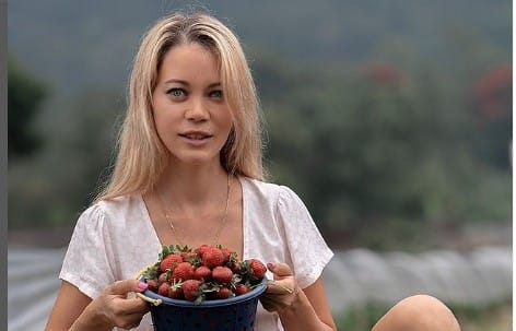 Sofie Mills collecting strawberry