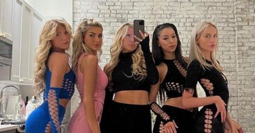 Lauren Wolfe in modeling poses with her friends