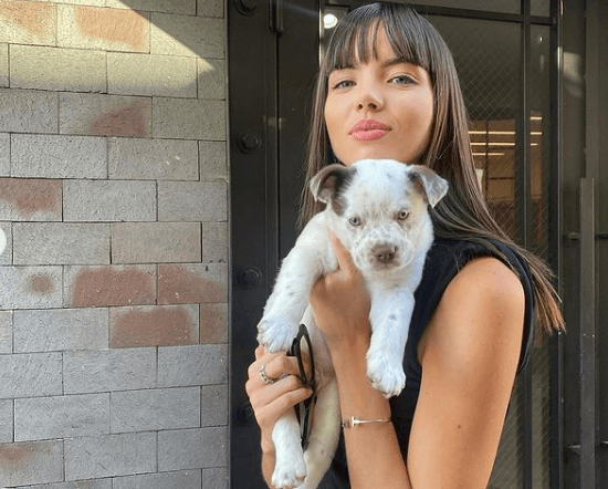 Adriana Mora with her pet dog