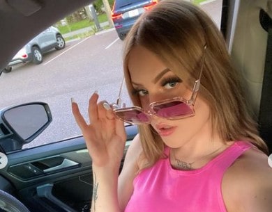 Caleigh Hayes looks gorgeous in a pink outfit and glasses