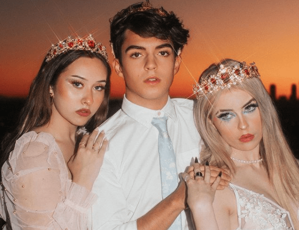 Brooklyn Webb poses with two social media stars