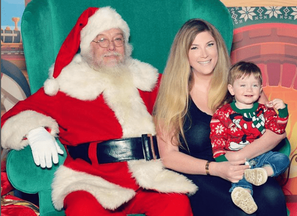Elle Fowler with her son and Santa celebrating Christmas