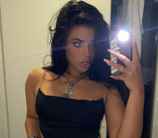 Marina Mendes taking selfies in a black top