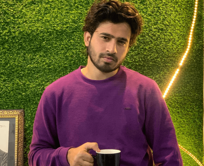 Nazim Ahmad drinks coffee