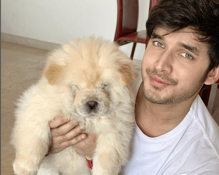 Paras Kalnawat with his pet dog