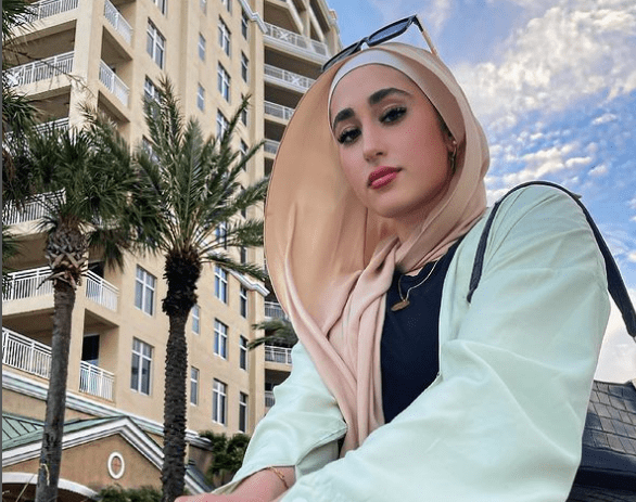 Alia Deeb looks cute and innocent in a sky blue hijab and grey headscarf