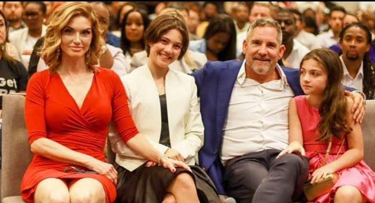 Elena Cardone with her husband Grant Cardone and their daughters attending an event