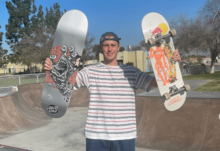 Jake Wooten showcasing his skateboards