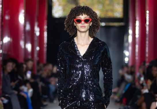 Jordan Rand walks on a fashion show