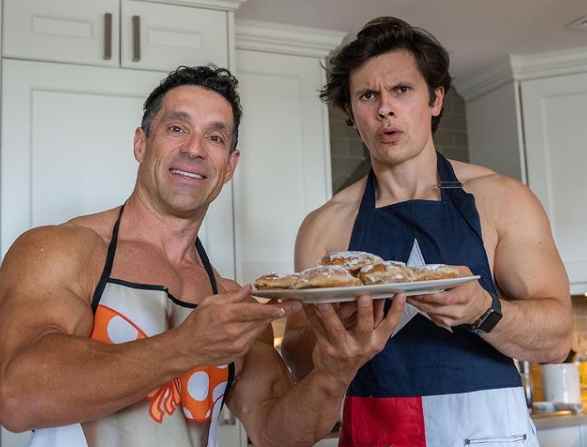 Will Tennyson with a fellow fitness personality cooking foods