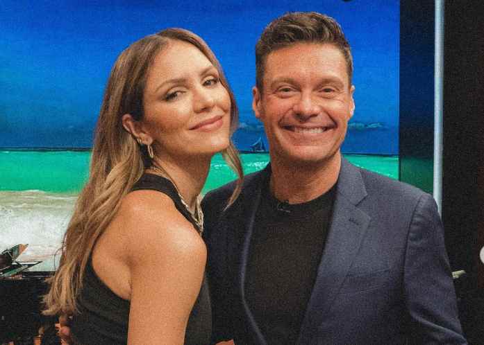 Ryan Seacrest with an actress