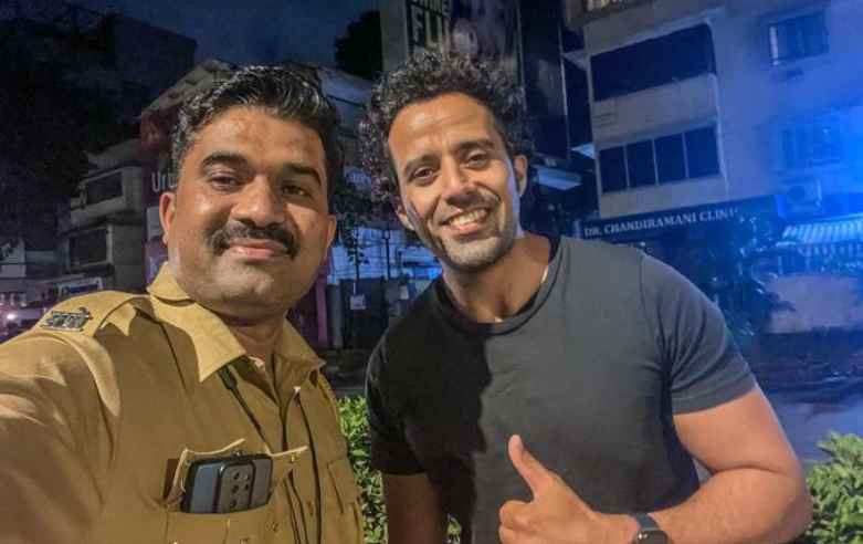Anil Charanjeett with a police man