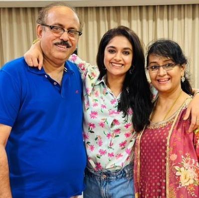 Keerthy Suresh along with her parents 